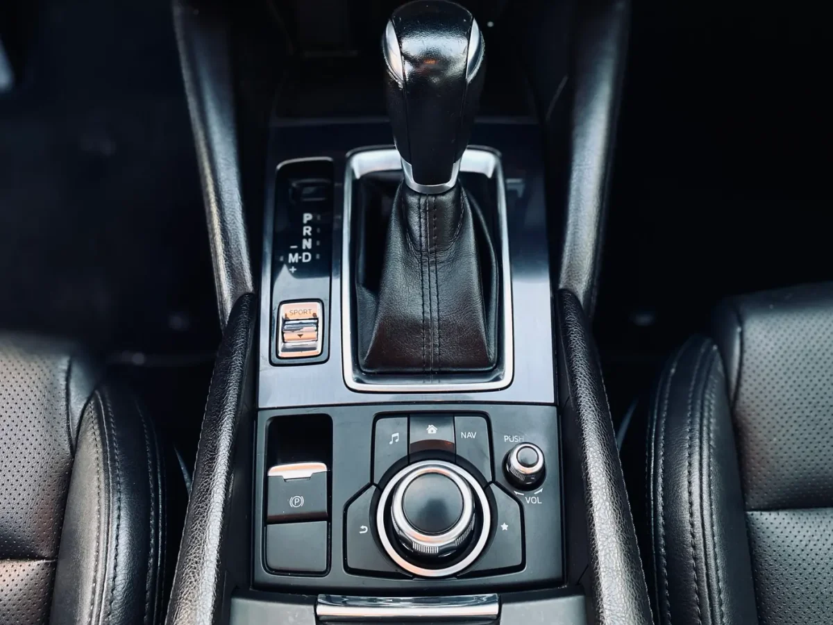 Clean Mazda center console, gear selector, and controls